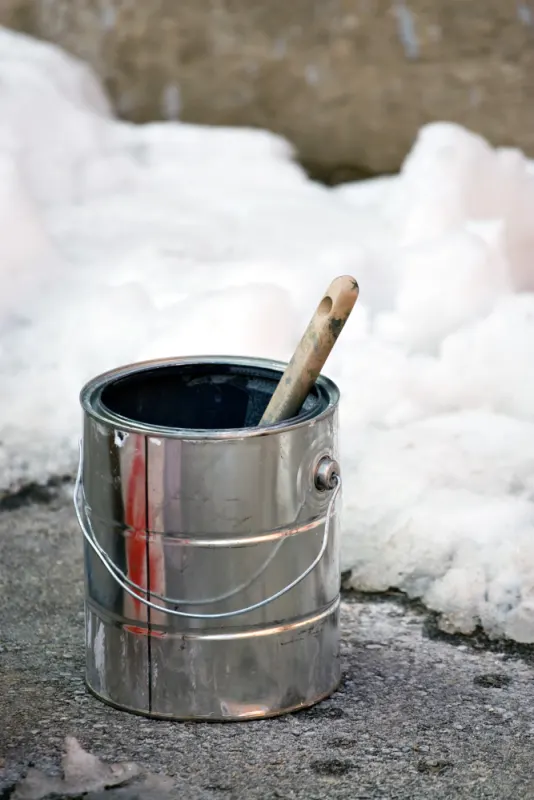 The low temperature causes incompletely dried layer during the painting process