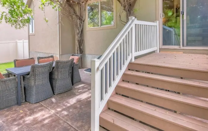 Outdoor stairs landing from a door. exterior stairs, outdoor stairs, exterior, deck