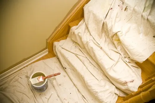 Drop cloths laid on floors and stairs for protection