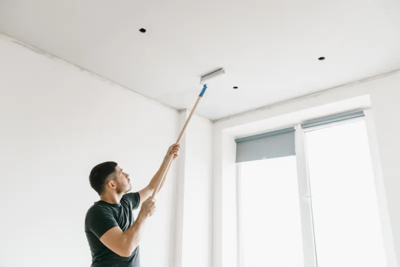 Use a roller to prime large section of the ceiling