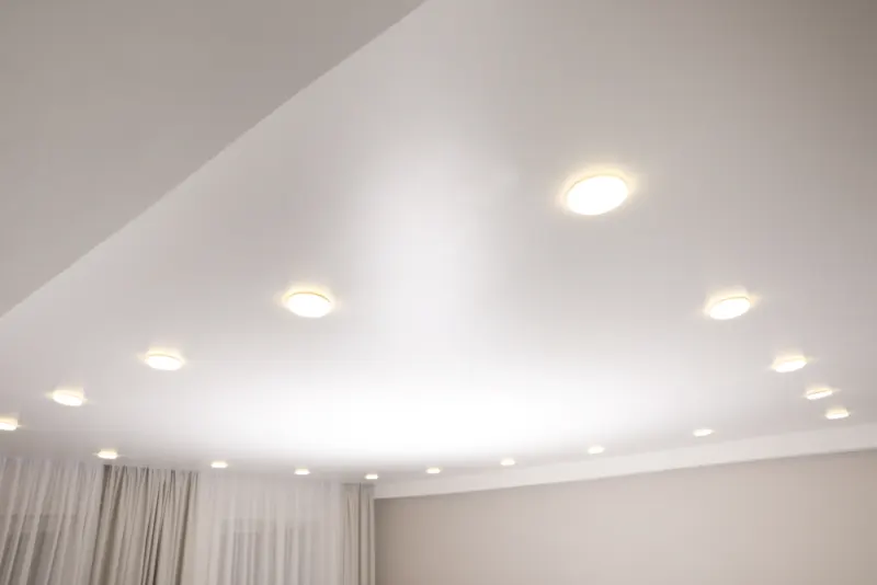 Unthread the base of the light fixtures and let hang from the ceiling is the easy way to paint a ceiling