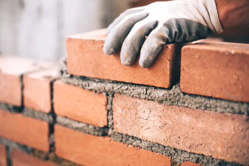 To avoid any missed spots, use a brush to meticulously paint along all the mortar lines first.