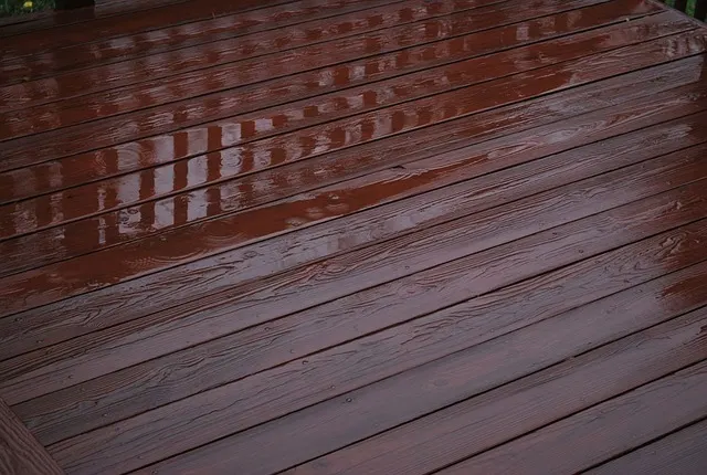 Close-up view of a dark wooden deck that has been stained.