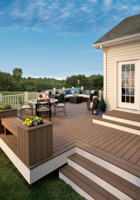 A fresh painted brown deck of a nice house.