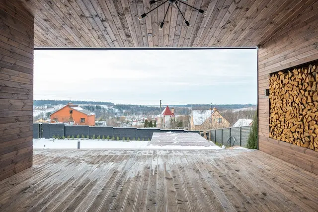 Wooden deck after maintenance with a city view on the background.