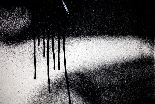 A wall sprayed with a black paint