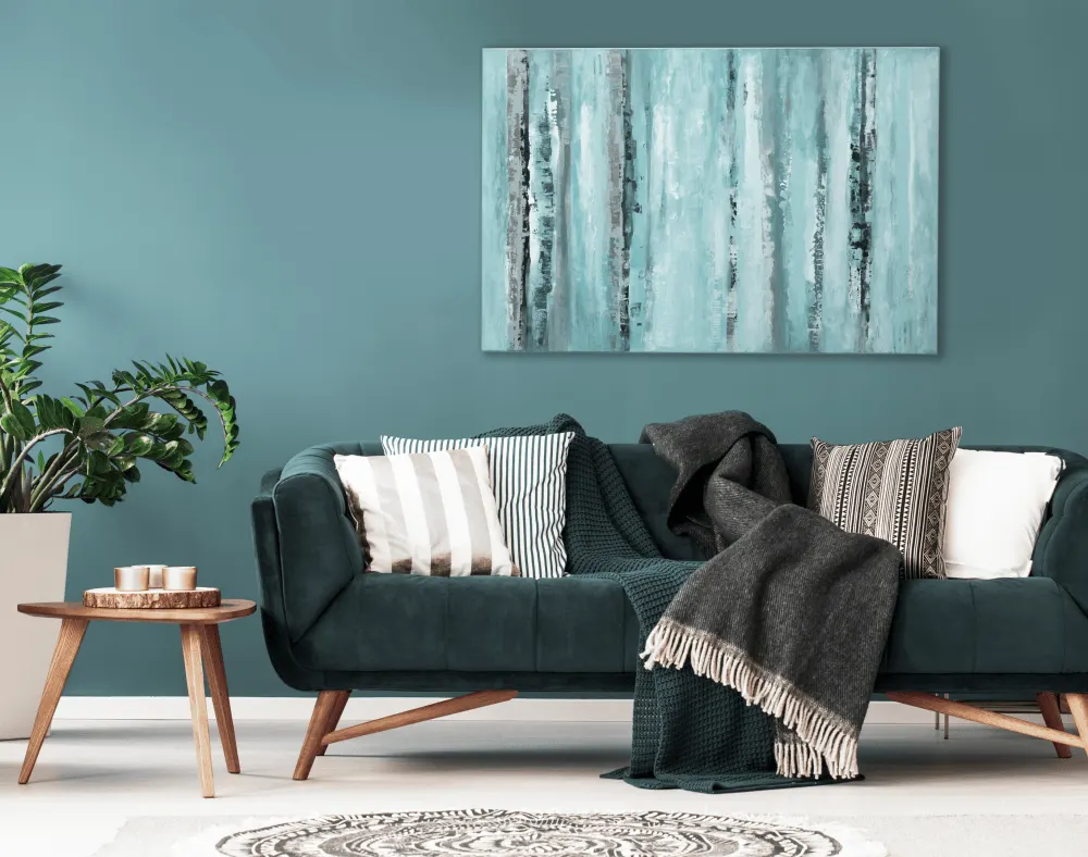 A cyan colour accent wall in the living room.