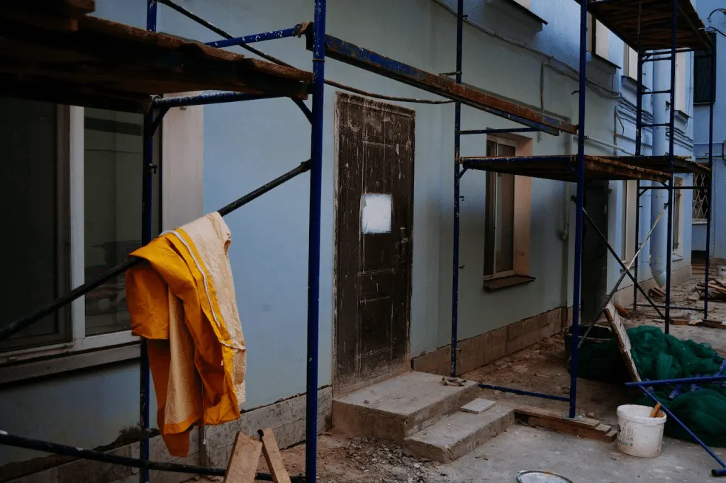 A house with scaffolding around it.
