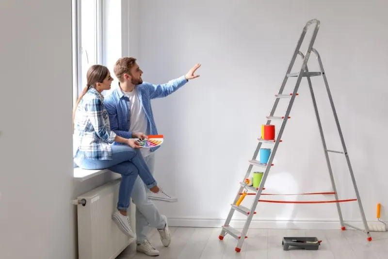 A couple is imagining a new colour ideas for the white room.