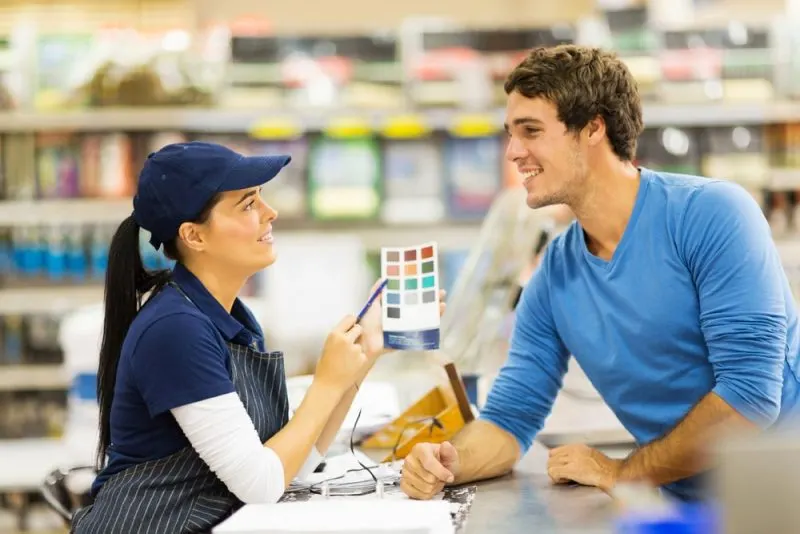 The saleswoman is advising color to the client.