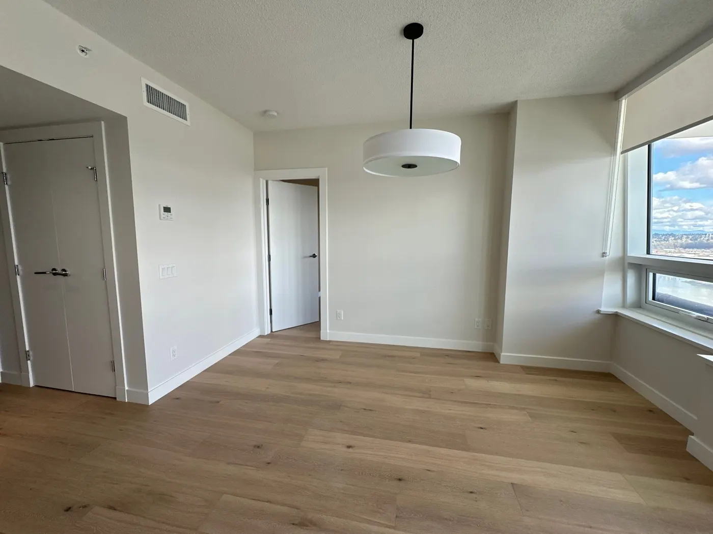 A freshly painted dry walls in an empty white room.