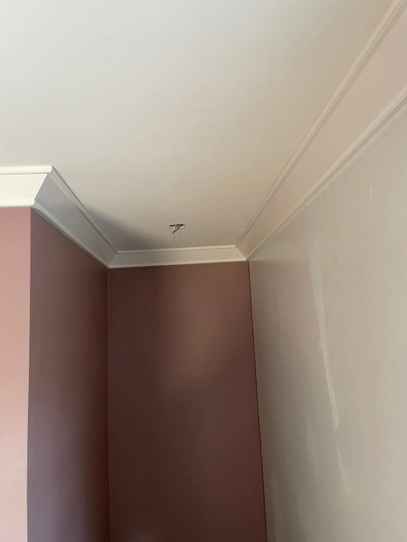 Room with crown molding on walls and ceiling, decorative home enhancement