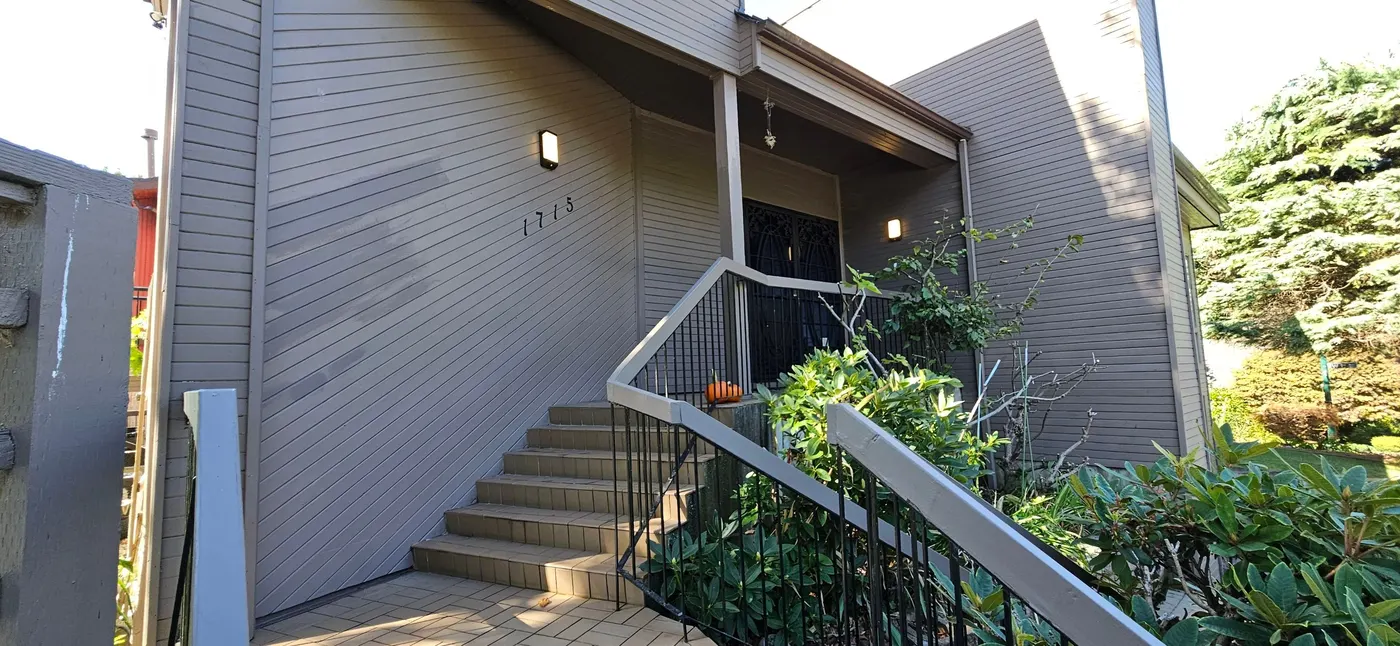 Front entry stairs and taupe painted siding at a Vancouver residential exterior painting project by Renaissance Painting.