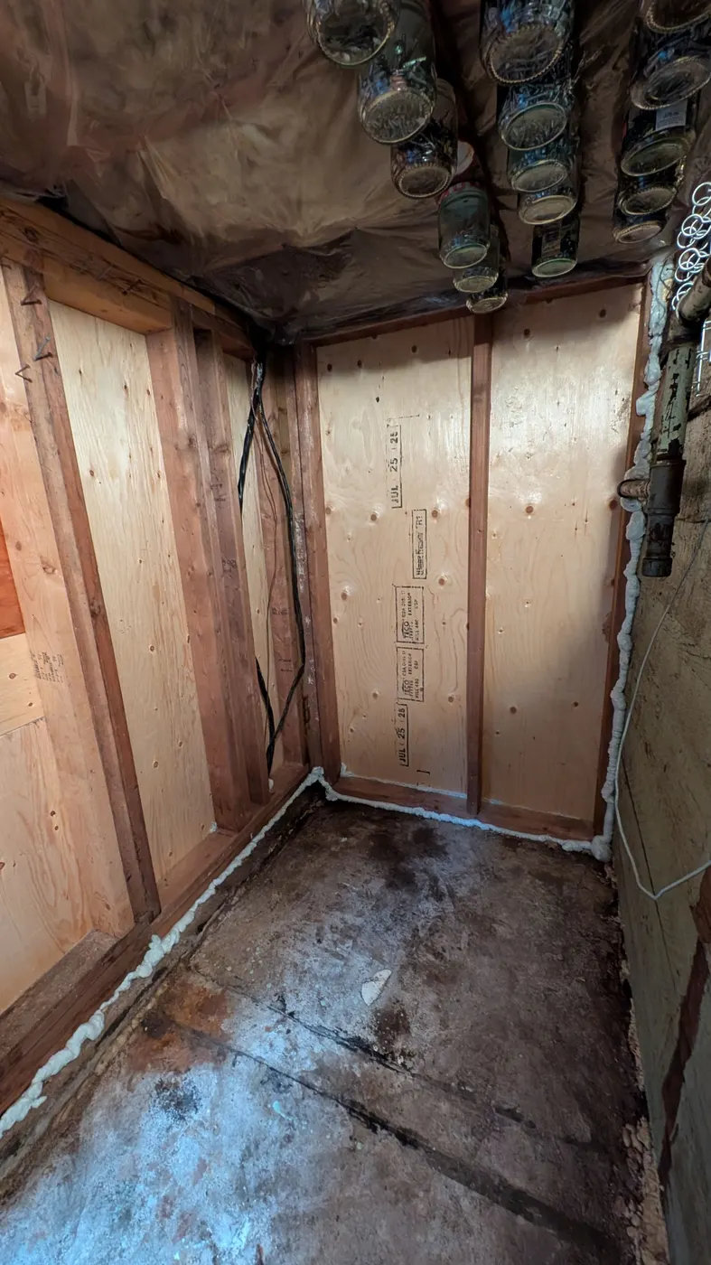 Weather-resistant barrier wrapped around a rebuilt porch column during exterior carpentry work in Vancouver, BC