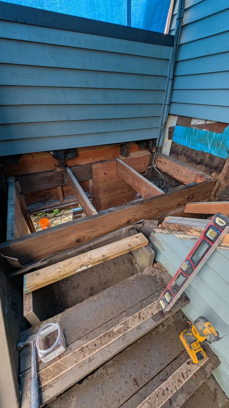 Open deck framing exposed during a structural repair project on a Vancouver, BC home.