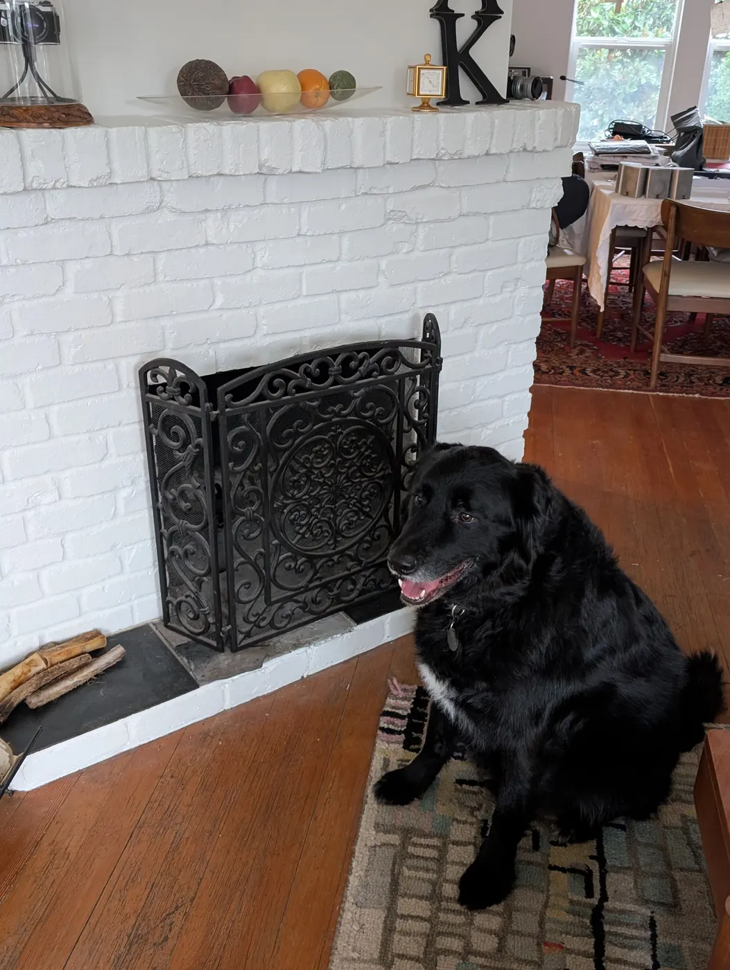 Finished white-painted brick fireplace with mantel decor in a Vancouver, BC living room