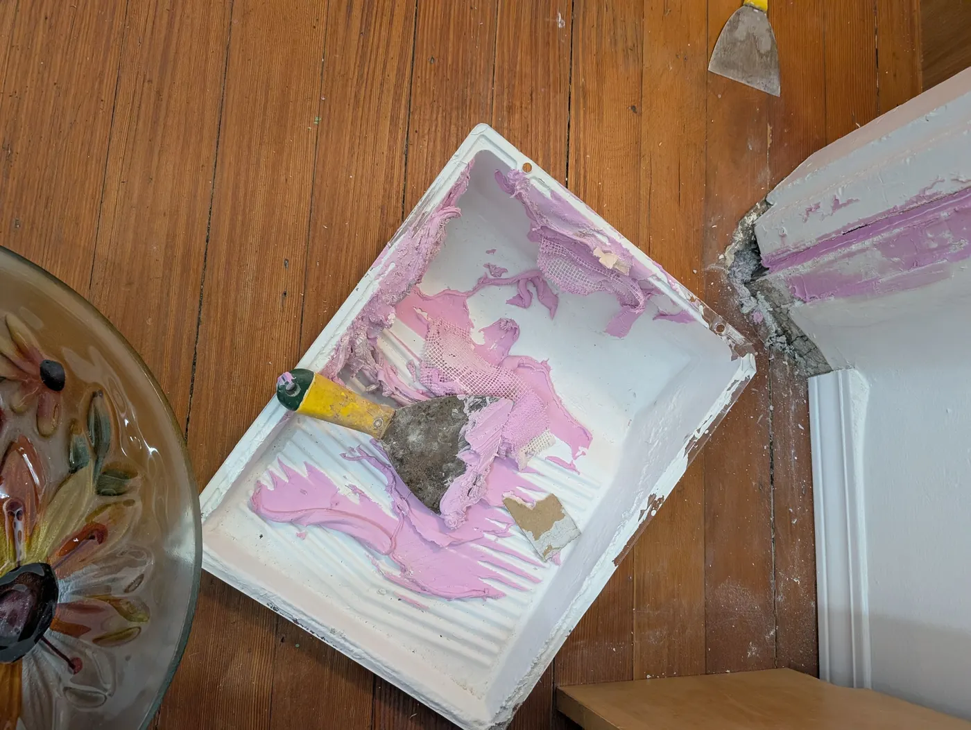 Drywall patch repair around a ceiling light fixture box during renovation prep in Vancouver, BC