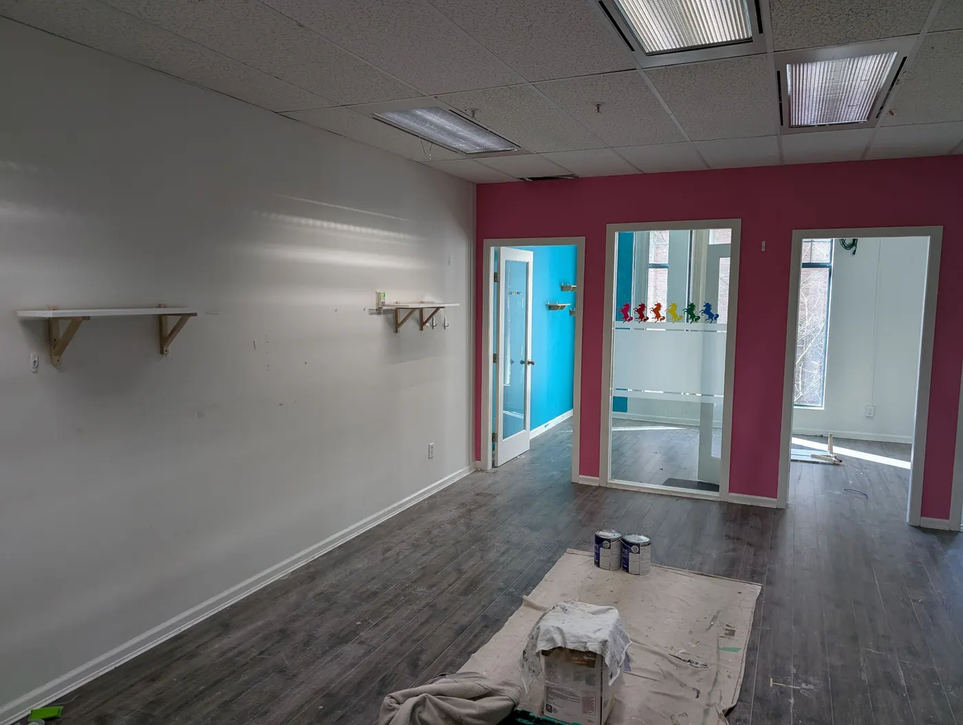 Freshly painted bright pink accent wall in a Vancouver childcare office renovation