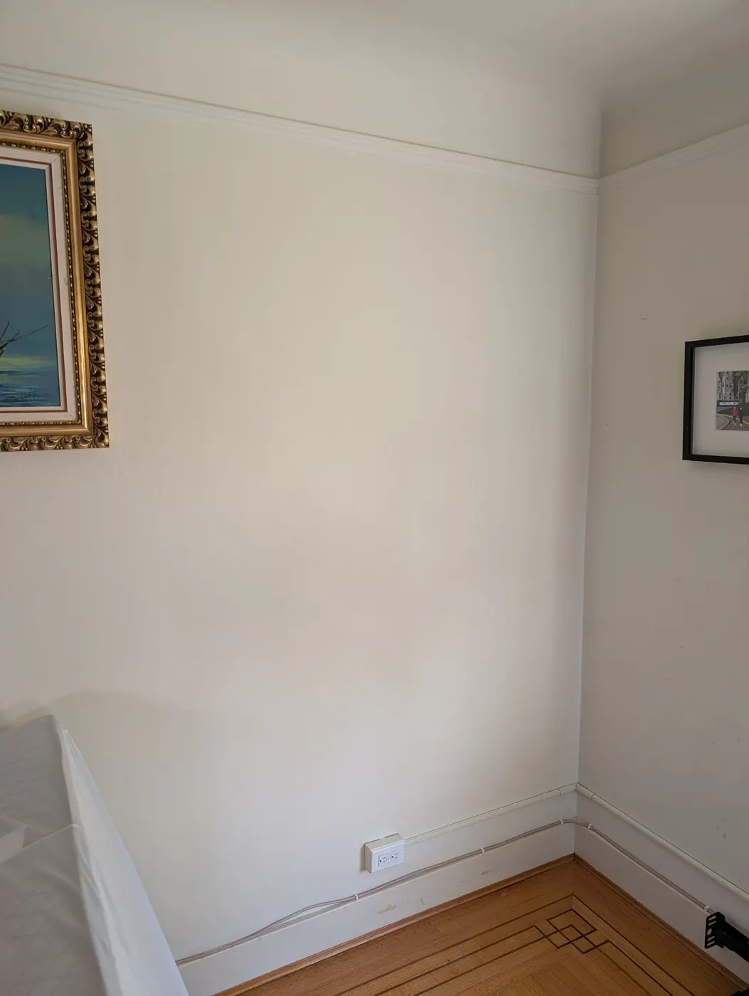 Smooth, freshly painted bedroom wall corner in a Vancouver character home