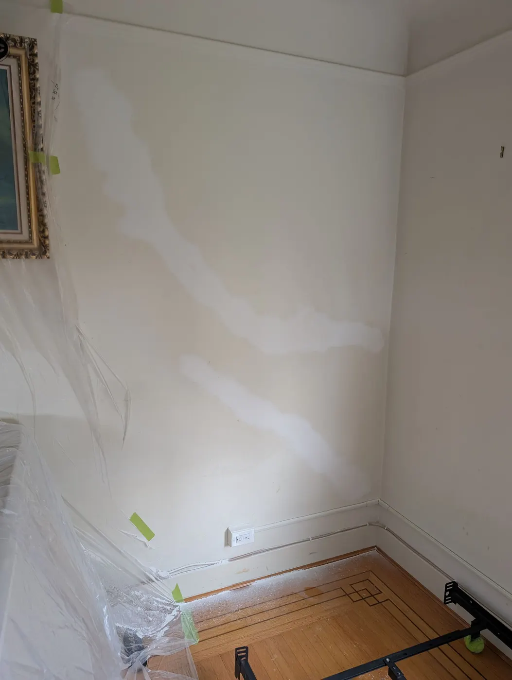 Freshly primed bedroom wall corner during an interior painting project in Vancouver