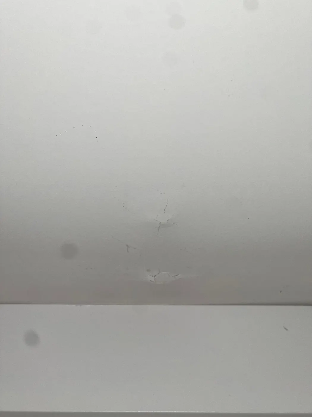 Drywall ceiling crack repair before painting in a Vancouver, BC home renovation on West 11th Avenue.