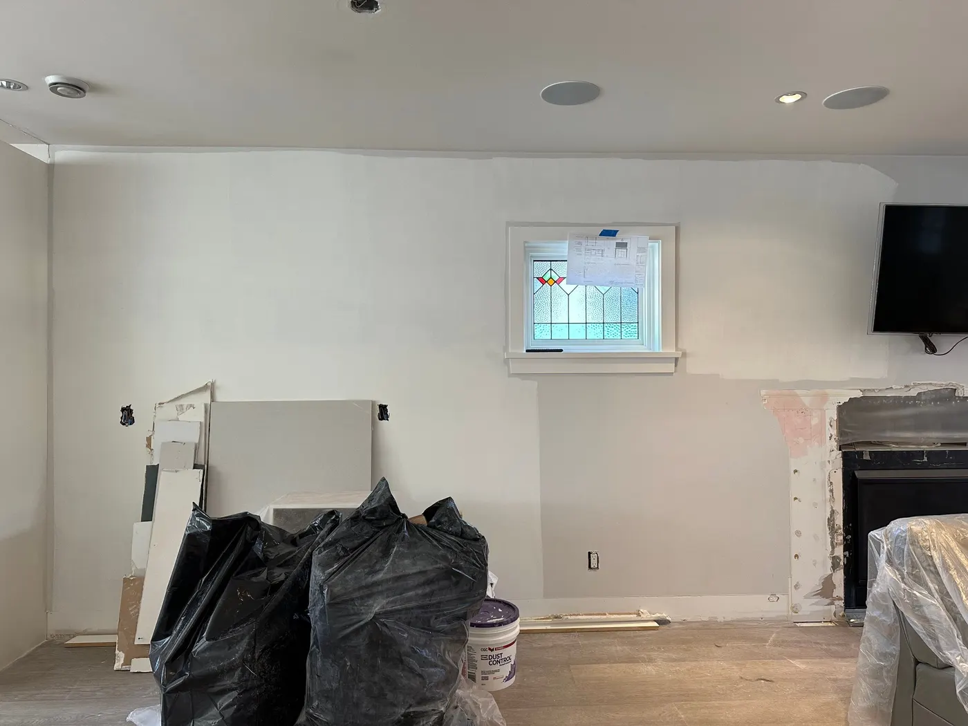 Drywall corner and crown repair in a Vancouver living room during a painting and carpentry renovation.