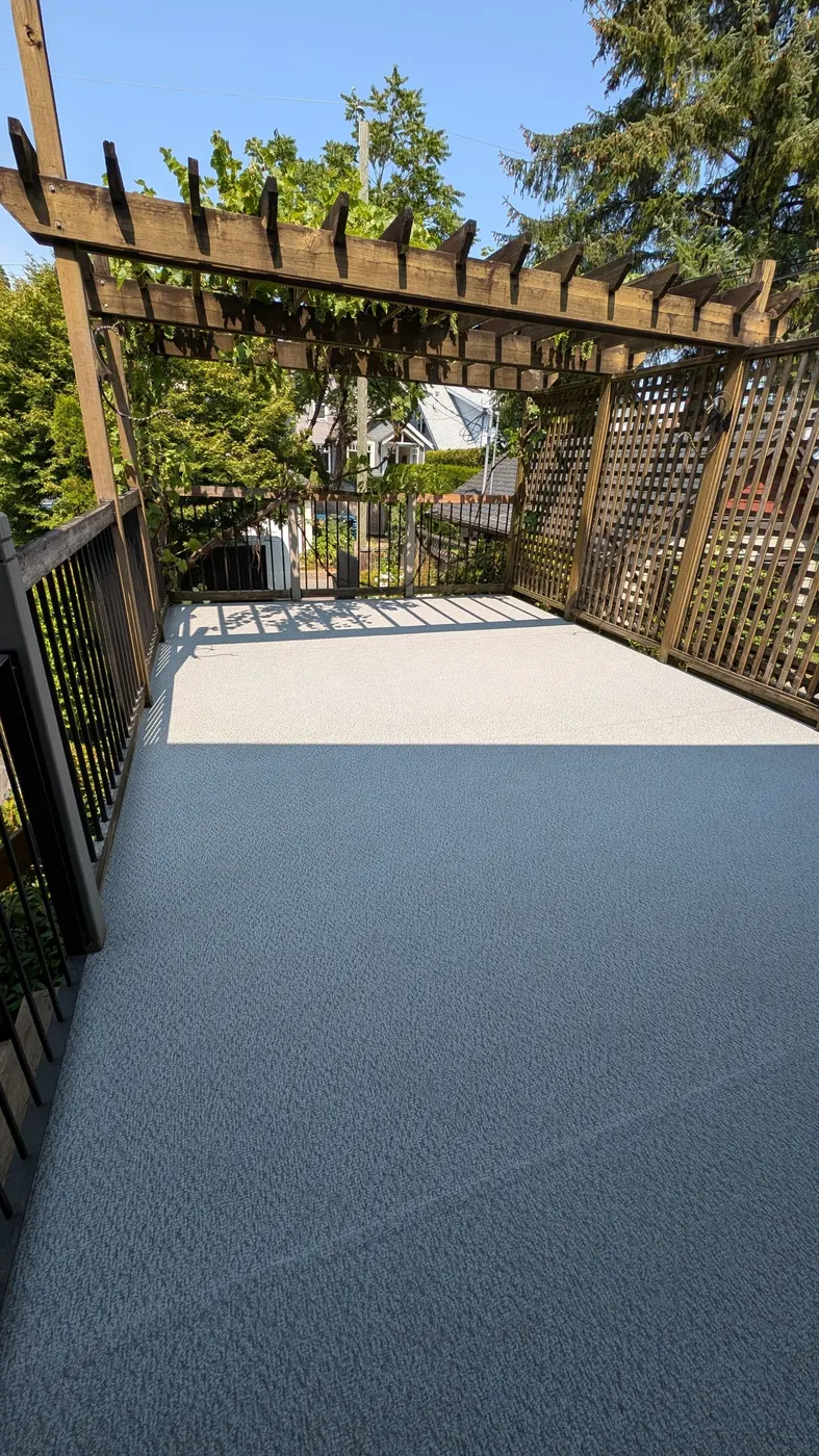 Wide view of a finished vinyl deck resurfacing project on a Vancouver, BC home