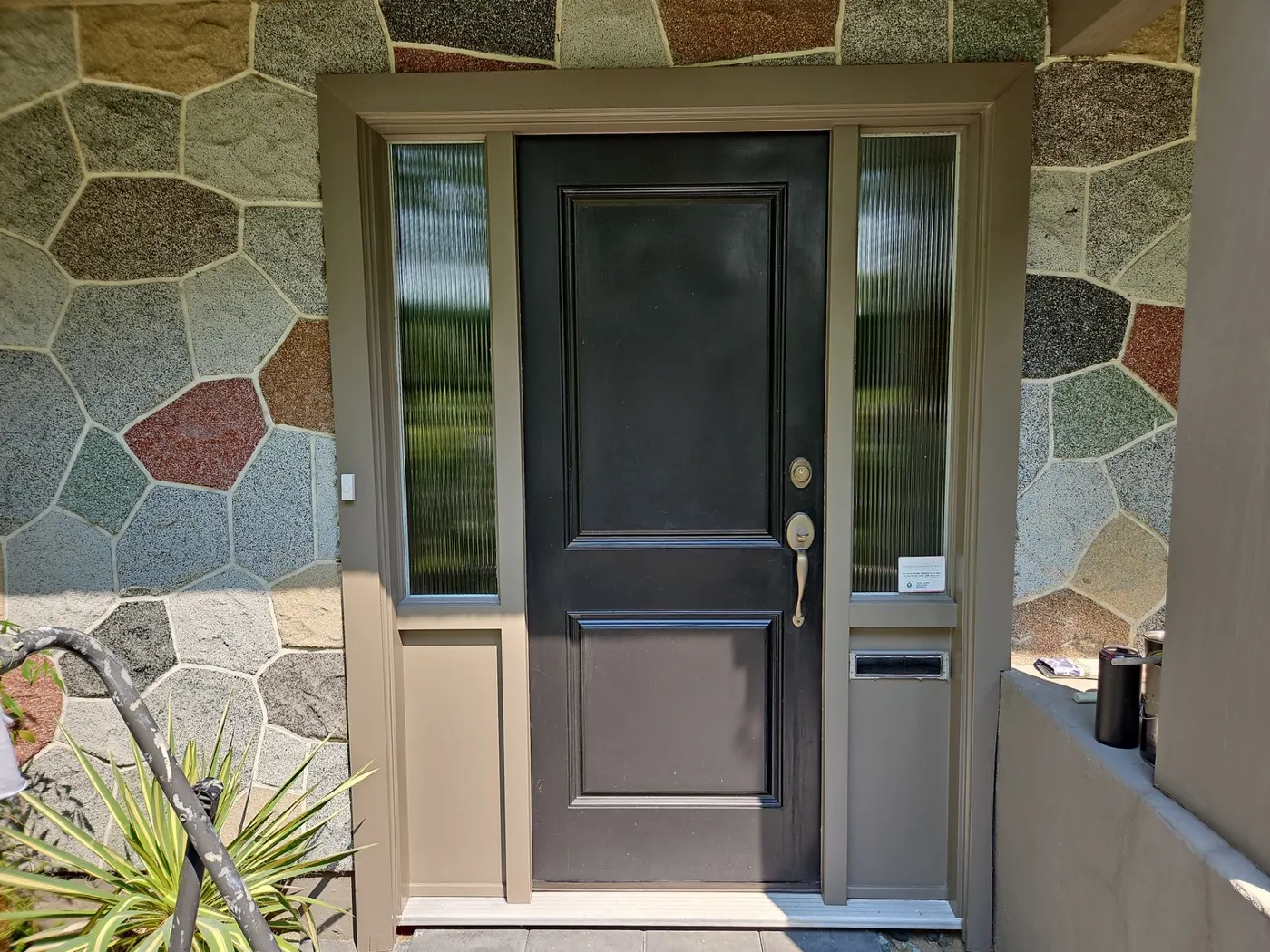 Freshly painted black front door on a Vancouver, BC home by Renaissance Painting
