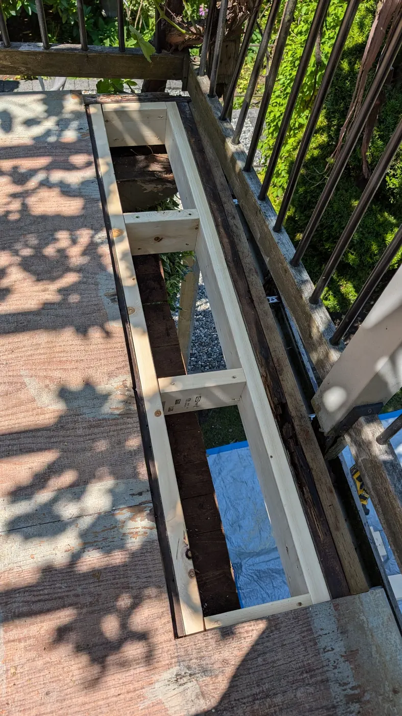 New lumber framing installed to repair rotted deck structure on a Vancouver, BC home