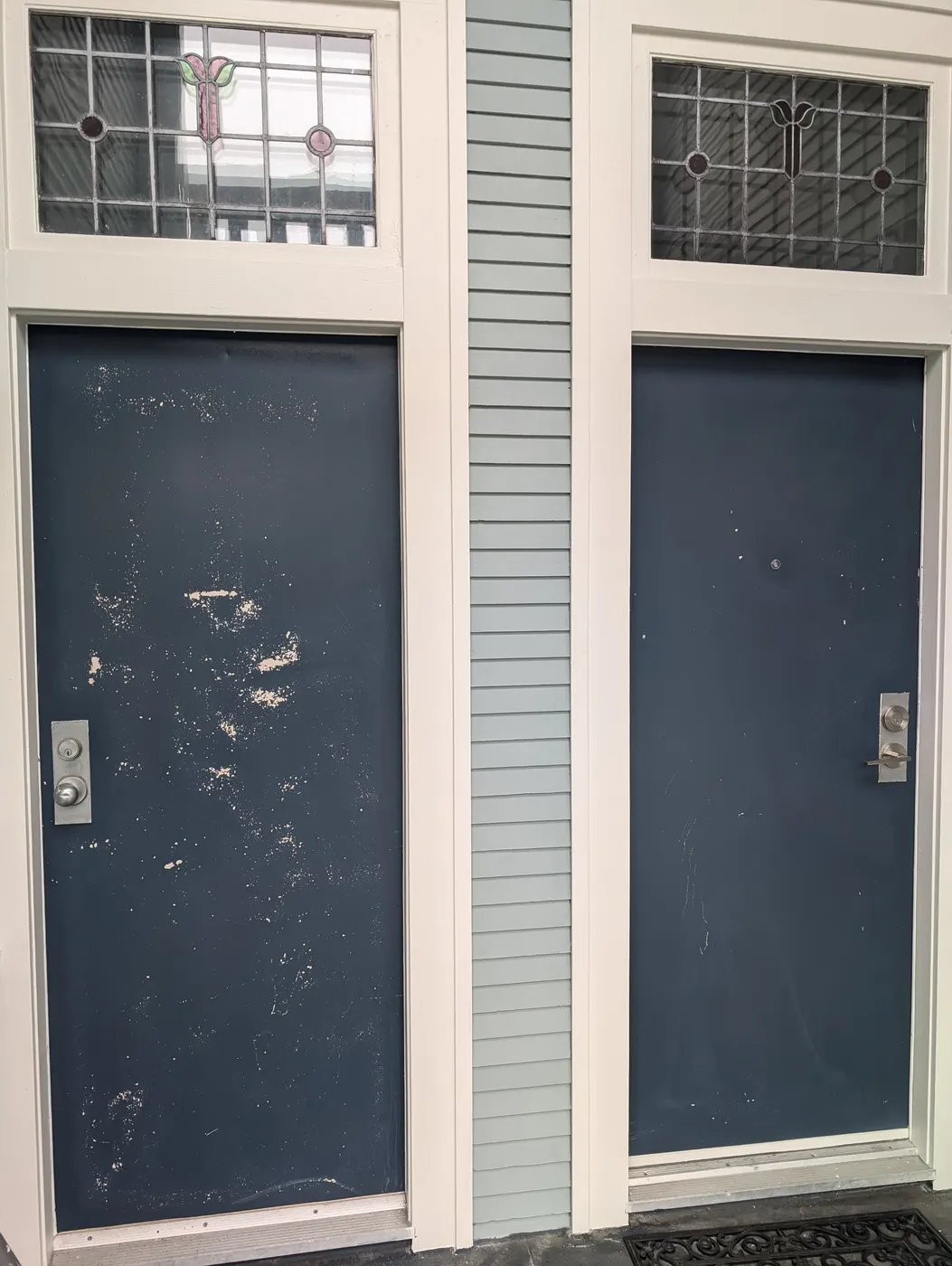 Side-by-side comparison of a weathered, paint-chipped front door next to a freshly repainted matching door on a Vancouver, BC home