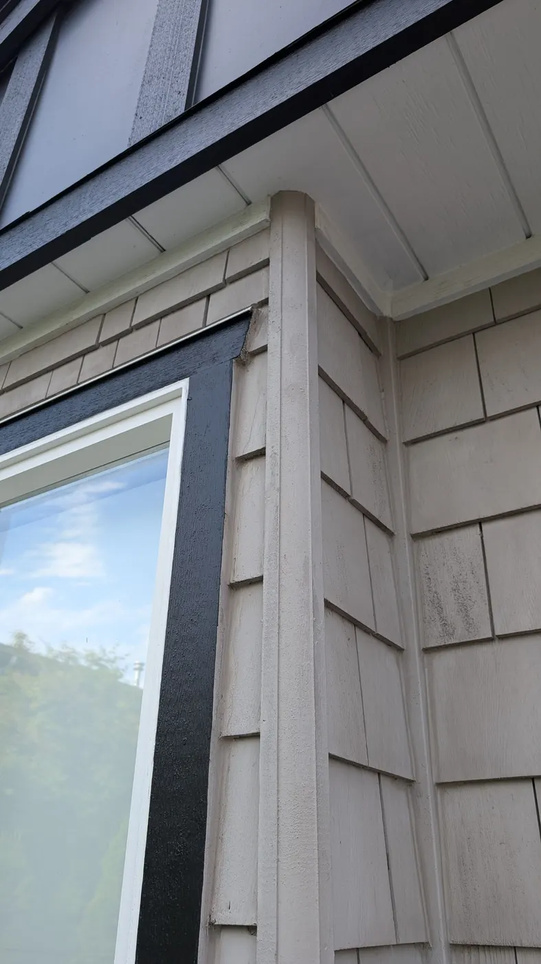 Clean painted exterior corner trim and cedar shingle siding on a Vancouver, BC home