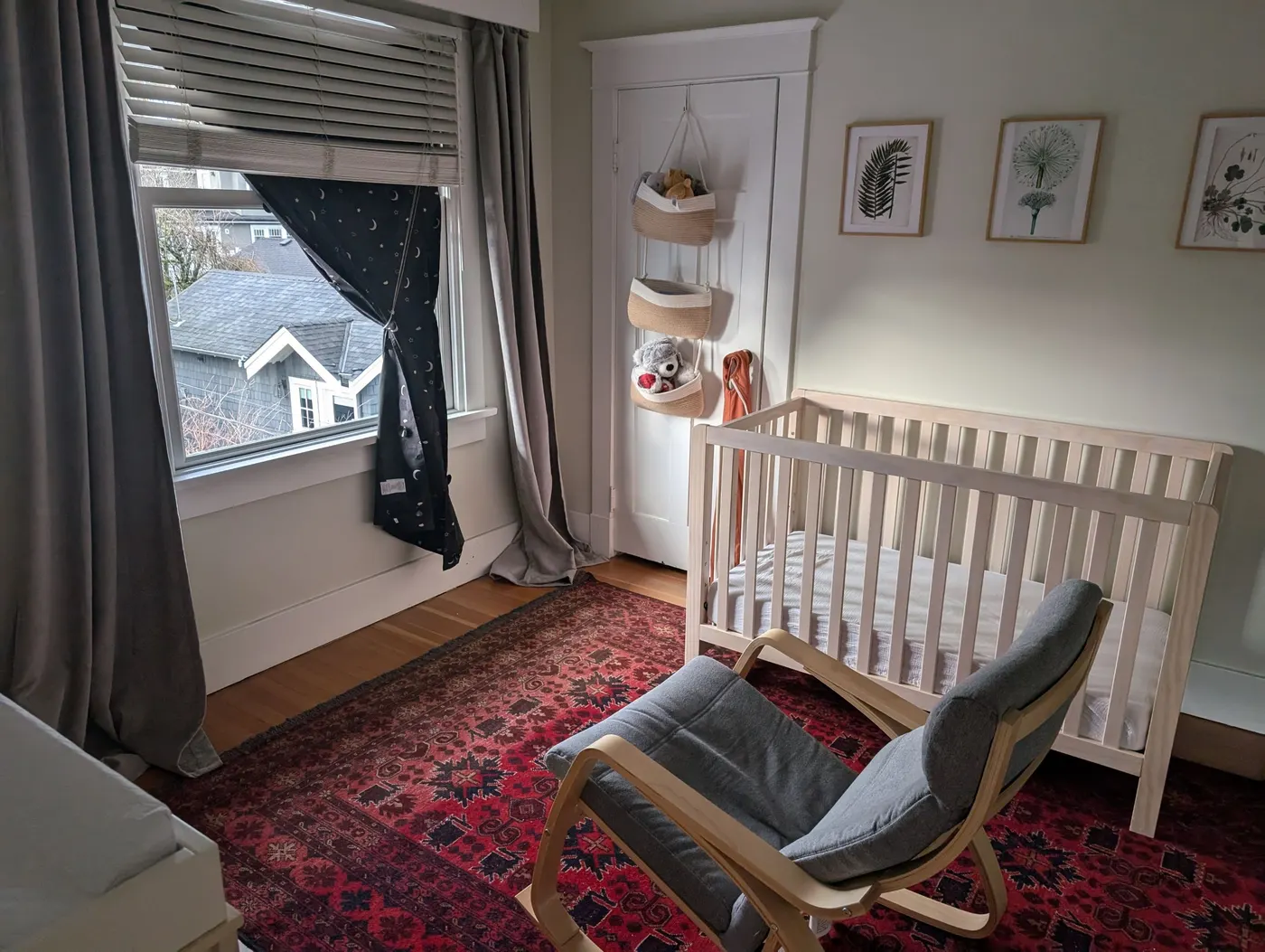 Freshly painted nursery bedroom with crib and rocking chair in a Vancouver, BC character home by Renaissance Painting