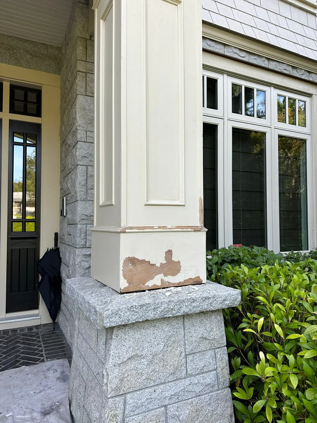 Weathered wood porch column base showing rot damage before repair at a home in Beechwood, Vancouver, BC.