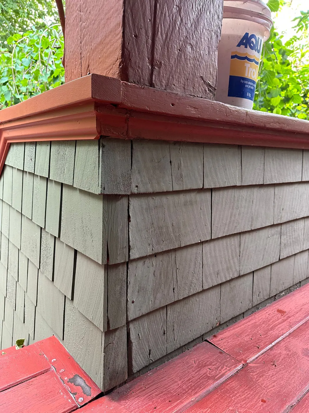 Close-up of freshly painted cedar shingle siding corner detail on a Vancouver home exterior
