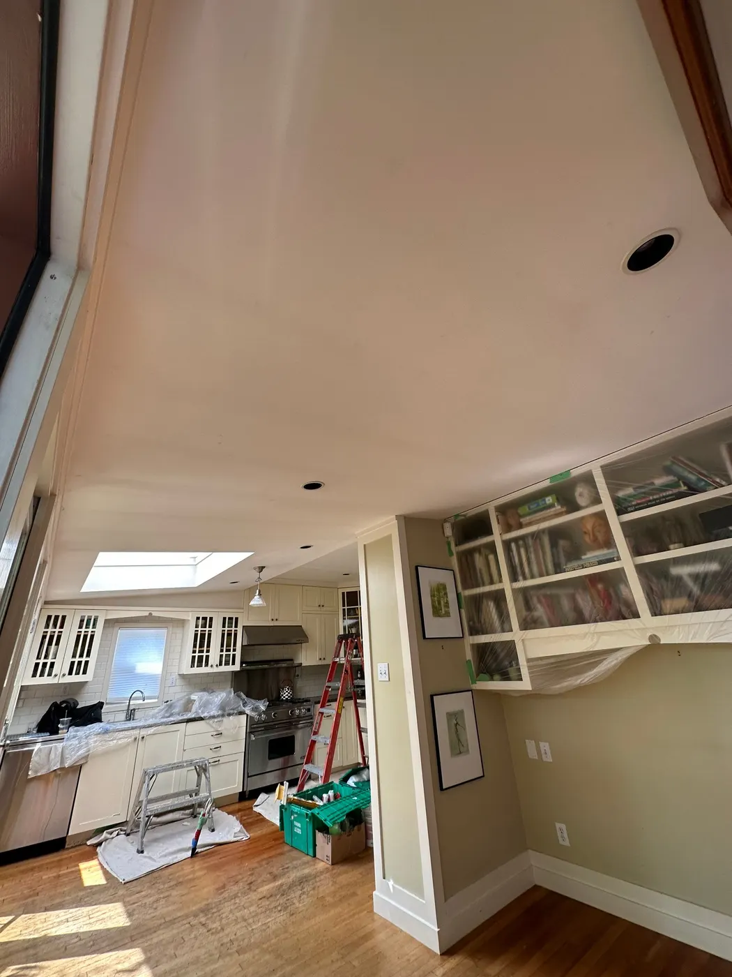 Kitchen in a Vancouver home protected with plastic sheeting during an interior painting project by Renaissance Painting.