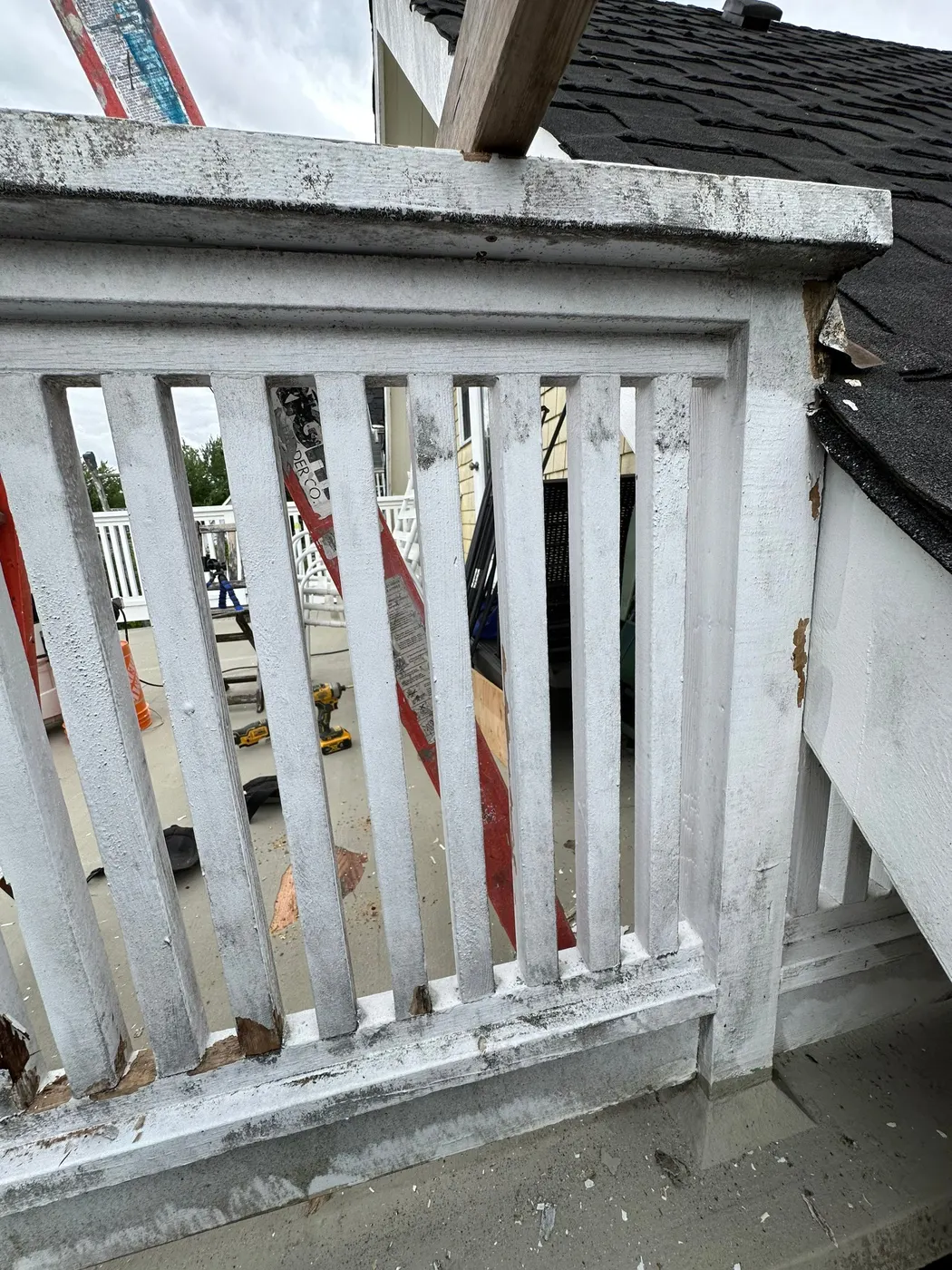 Newly patched deck flooring with fresh plywood repair on a Vancouver home before painting