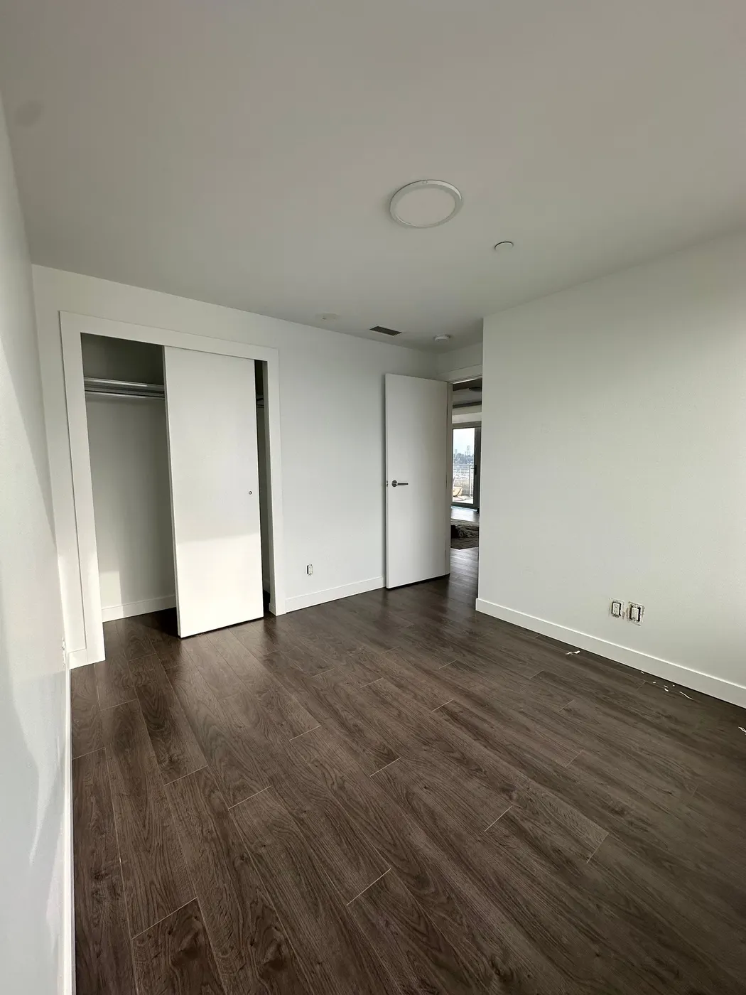 Empty bedroom with closet ready for interior painting in a Vancouver, BC condo