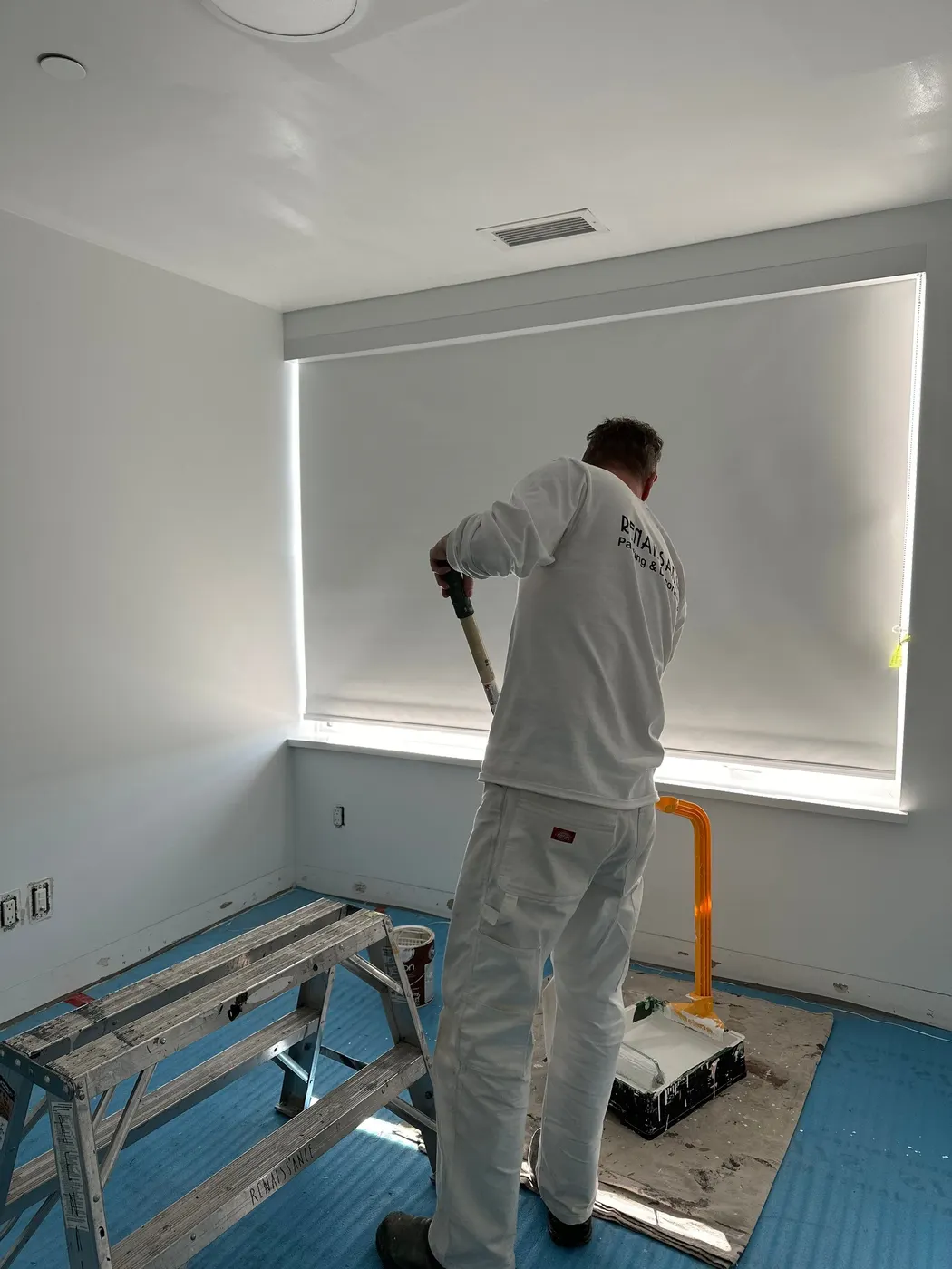 Renaissance Painting crew member rolling paint onto a wall in a Vancouver, BC condo