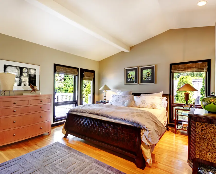 Bedroom with gray walls and white ceiling, matches furniture.