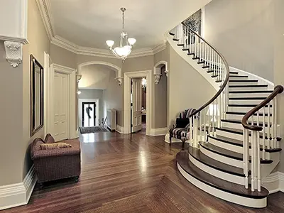 High-end interior painting: off-white walls with white ceiling, staircase going upstairs