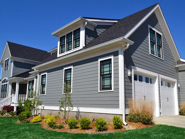 Painter company: House Exterior showing wood siding, wood windows and trim.