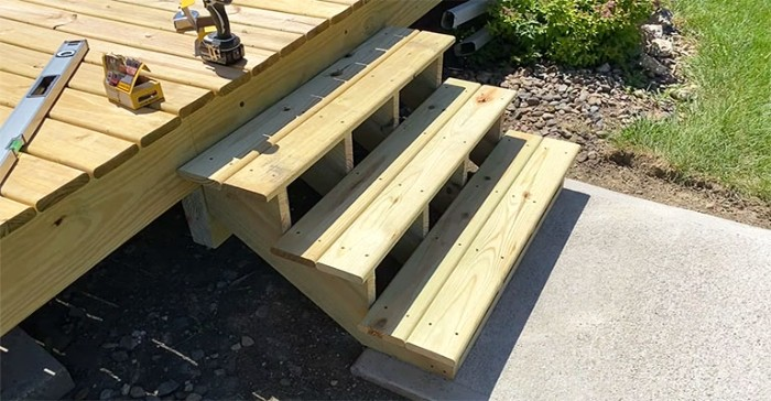 Deck stairs being built using pressure treated lumber. deck, exterior, exterior stairs, outdoor stairs