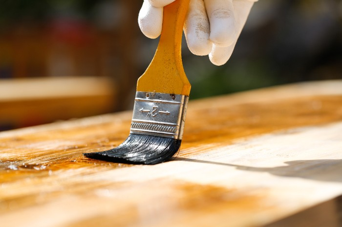 Applying resin during a outdoor restoration process. Outdoor Stairs, exterior stairs, exterior, outdoor, deck