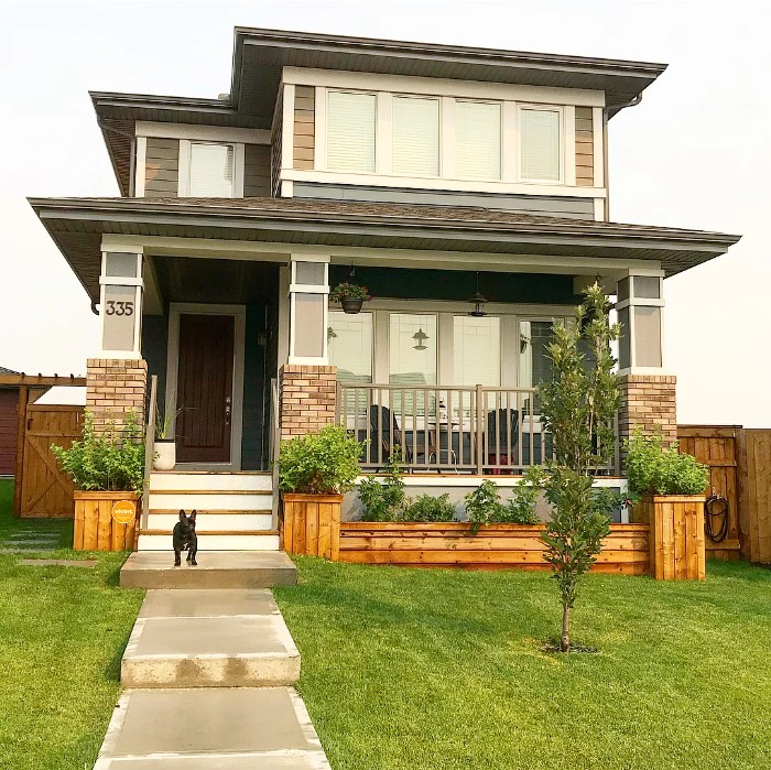 The landscaping is better than just plain grass. Focusses your attention on the front steps. staircase