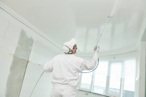 Spray painting a ceiling in Coal harbour