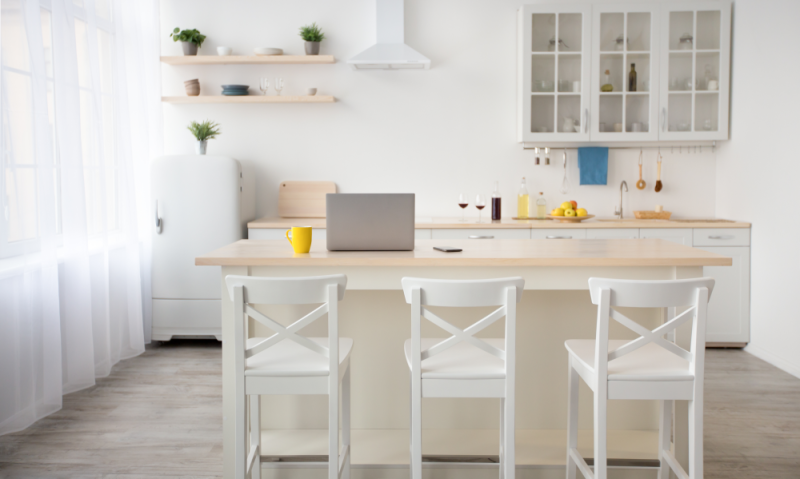 White cabinets and white walls in a tiny kitchen