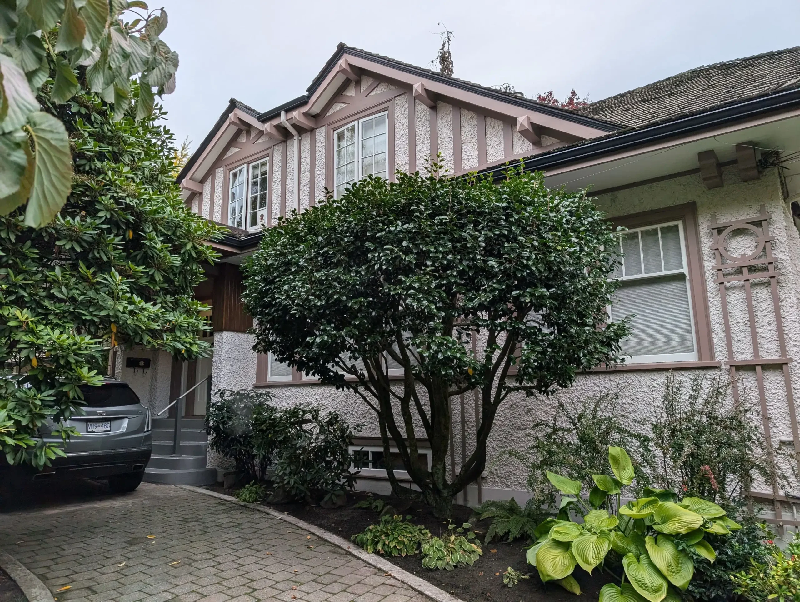 286c5c4a-09e1-4550-8f65-1337d7aba935 - Renaissance Painting Charming Vancouver heritage home with fresh exterior colours and lush landscaping enhancing its classic curb appeal.
