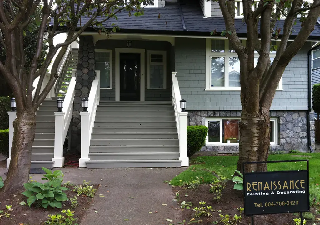Freshly painted Vancouver heritage home with crisp grey stairs and trim, showcasing professional exterior craftsmanship.