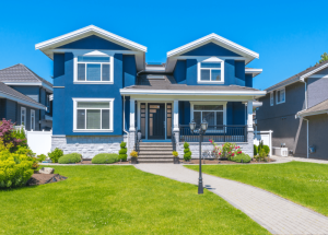 A big house with a fresh painted dark blue colour exterior.