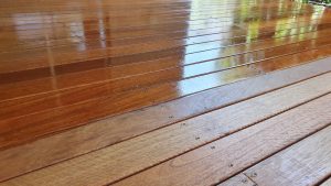 Close-up view of a wooden deck that has been stained.